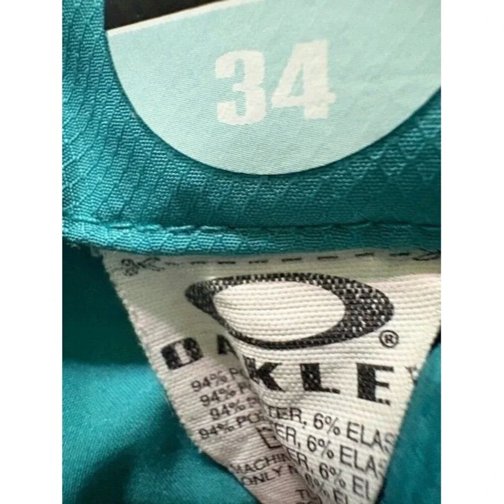 OAKLEY Swim Trunks‎ Men's Size 34 Green Stripe Board Surfer Logo Beach